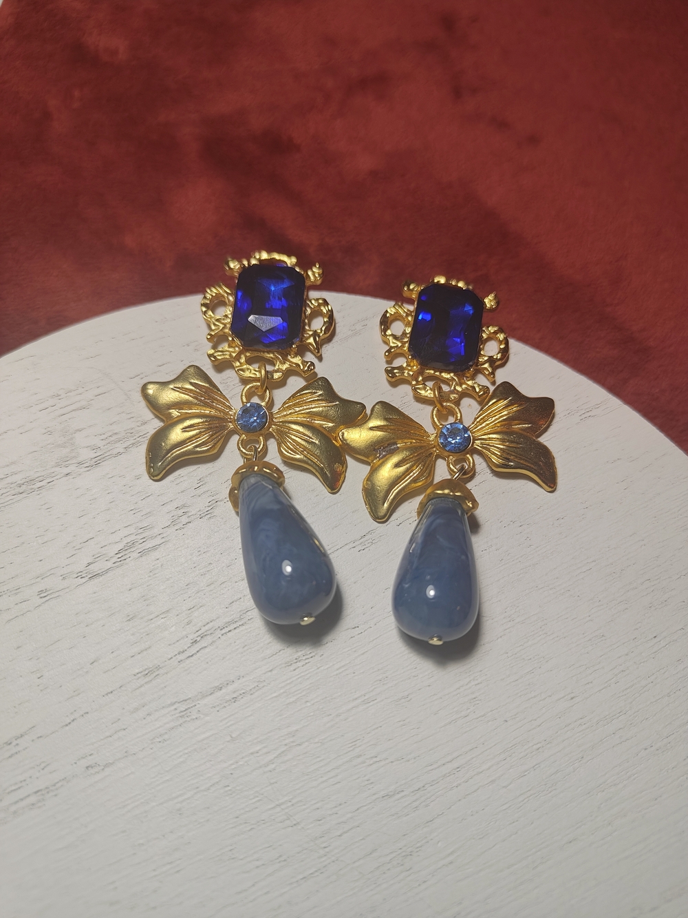 Gold Bow Drop Earrings with Sapphire Blue Stones